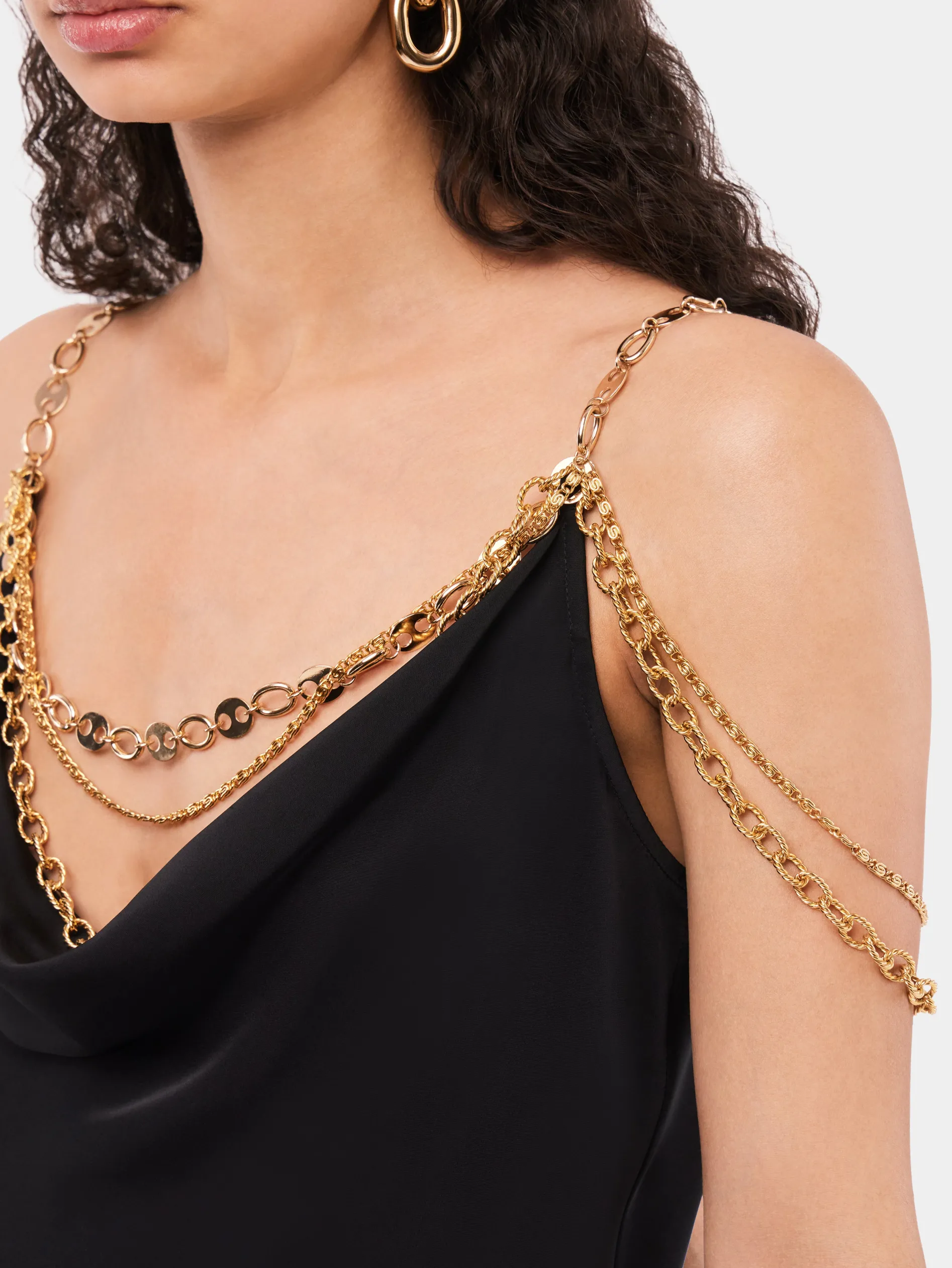 Store Top noir avec bretelles ornées de la chaîne signature "Eight"n Hauts